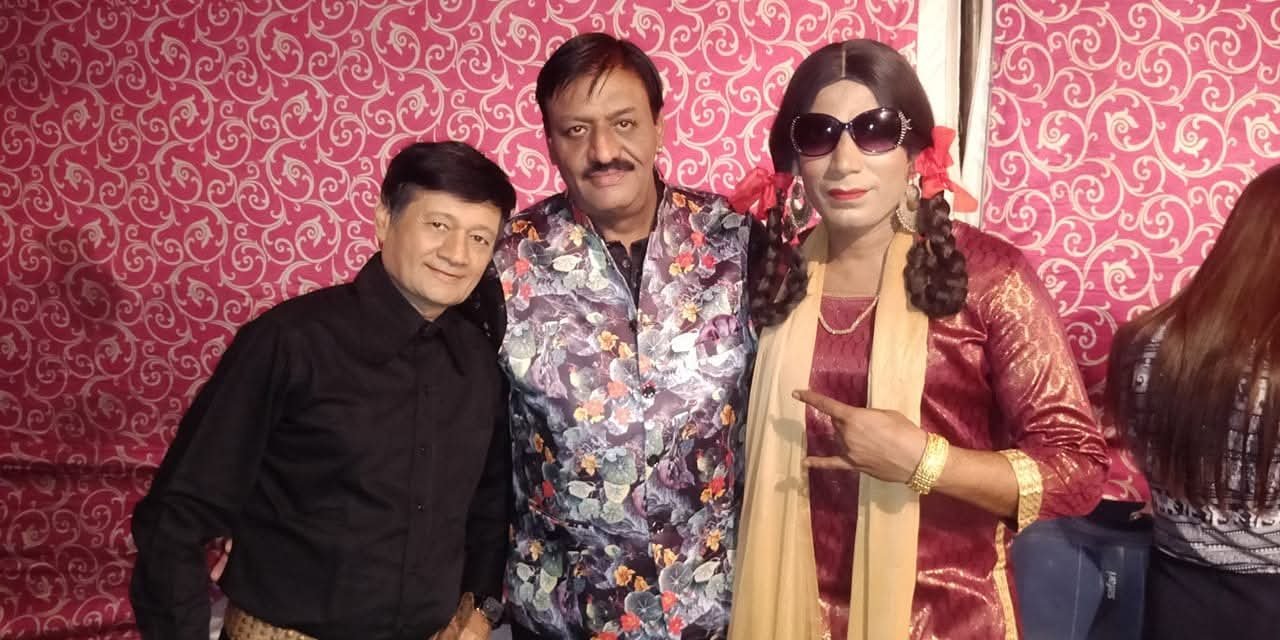 Artists with a Comedy Performer at a Celebration