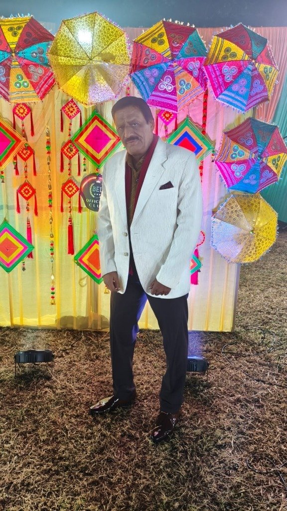 Rajesh Bajaj of Star Musical Entertainer at themed stage entrance backdrop